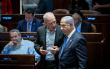 Prime Minister Benjamin Netanyahu (right) and Defense Minister Yoav Gallant (center) attend a vote in the Knesset, July 24, 2023. (Yonatan Sindel/Flash90)