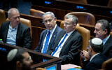 Justice Minister Yariv Levin (second from left, flanked by Prime Minister Benjamin Netanyahu and Defense Minister Yoav Gallant to his right, and National Infrastructure Minister Yisrael Katz during a vote on the reasonableness limitation bill in the Knesset plenum, July 24, 2023. (Yonatan Sindel/Flash90)