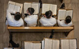 Yeshiva students study at the Kamenitz Yeshiva, in Jerusalem on July 25, 2023. (Chaim Goldberg/Flash90)