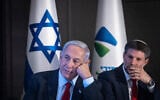 Prime Minister Benjamin Netanyahu, left, and Finance Minister Bezalel Smotrich at a press conference on the planned construction of a new railway line from the northern city of Kiryat Shmona to the city of Eilat, in Jerusalem, July 30, 2023. (Chaim Goldberg/Flash90)