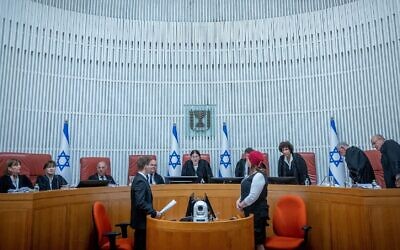 Supreme Court President Esther Hayut (center) and Supreme Court justices arrive for a court hearing at the court in Jerusalem to hear petitions against the so-called 'Tiberias Law,' on July 30, 2023. (Yonatan Sindel/Flash90)