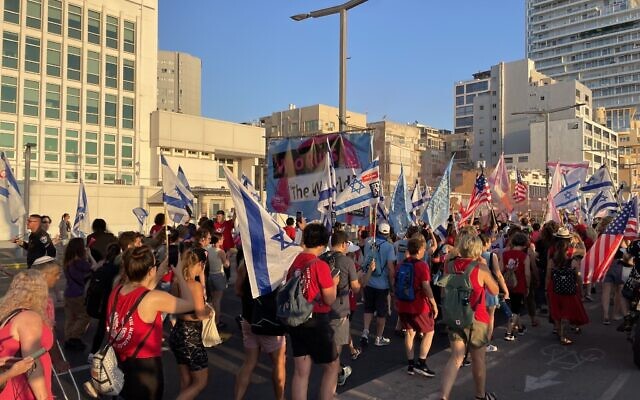 Anti-overhaul protesters gather outside the US Embassy's branch office in Tel Aviv on July 19, 2023. (Carrie Keller-Lynn/Times of Israel)