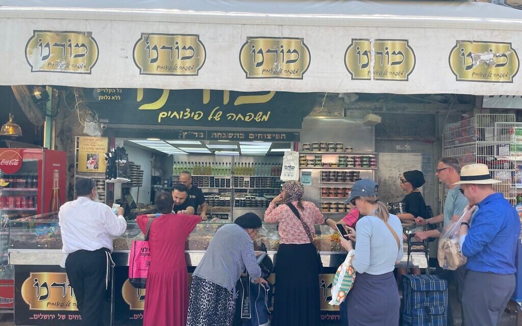 The Moreno nut stall in Mahane Yehuda market in July 2023 (Jessica Steinberg/Times of Israel)