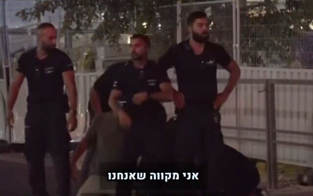 Police at an anti-overhaul protest in Tel Aviv are seen blocking Channel 13's cameraman from filming the brutal arrest of a demonstrator on July 24, 2023. (Screen capture/Twitter) Police at an anti-overhaul protest in Tel Aviv are seen blocking Channel 13's cameraman from filming the brutal arrest of a demonstrator on July 24, 2023. (Screen capture/Twitter)