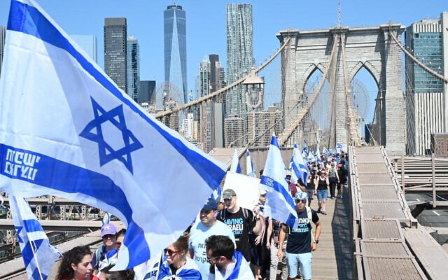 Israeli activists opposed to the judicial overhaul march across the Brooklyn Bridge in New York City, July 23, 2023. (Liri Agami) Israeli activists opposed to the judicial overhaul march across the Brooklyn Bridge in New York City, July 23, 2023. (Liri Agami)