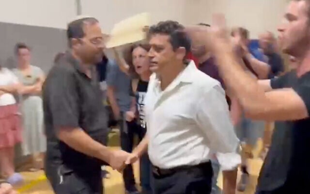 Diaspora Minister Amichai Chikli is driven out of a Tisha B'Av event by anti-government protesters in Jerusalem on July 26, 2023. (Screenshot/Twitter, used in accordance with clause 27a of the copyright law) Diaspora Minister Amichai Chikli is driven out of a Tisha B'Av event by anti-government protesters in Jerusalem on July 26, 2023. (Screenshot/Twitter, used in accordance with clause 27a of the copyright law)