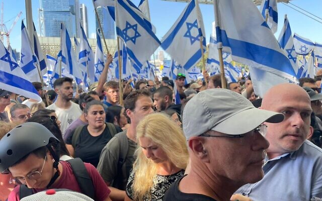 Protesters are blocked from entering Tel Aviv's Hashalom train station on July 18, 2023 (Carrie Keller-Lynn/Times of Israel)