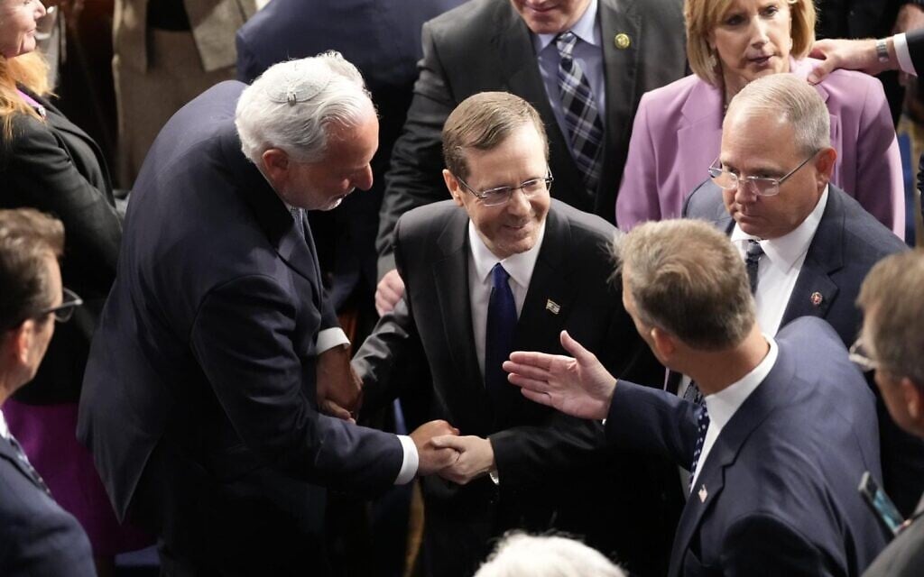 President Isaac Herzog is greeted by as he arrives to speak to a joint meeting of US Congress, July 19, 2023, at the Capitol in Washington (Chris Kleponis) President Isaac Herzog is greeted by as he arrives to speak to a joint meeting of US Congress, July 19, 2023, at the Capitol in Washington (Chris Kleponis)