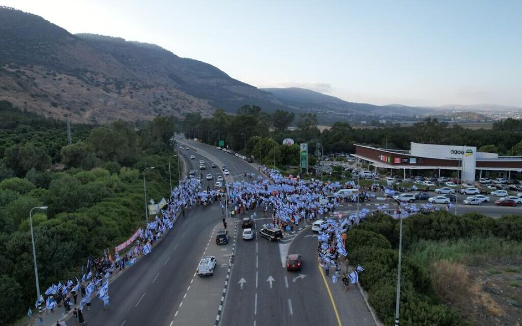Anti-overhaul demonstrators block the Gome Junction in northern Israel on July 29, 2023. (Eitan Slonim) Anti-overhaul demonstrators block the Gome Junction in northern Israel on July 29, 2023. (Eitan Slonim)