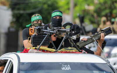 Palestinians visit an exhibition of the Izz ad Din al-Qassam Brigades, the military wing of the Hamas terror group, during the Eid al-Adha festival in Gaza City, on June 30, 2023. (Atia Mohammed/ Flash90)
