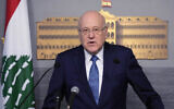 Lebanese caretaker Prime Minister Najib Mikati, speaks at the government palace, in Beirut, Lebanon, March 27, 2023. (AP Photo/Hussein Malla)