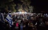 Anti-overhaul activists, who are marching to Jerusalem, gather at Shoresh outside the capital on Friday evening, July 21, 2023. (Aviv Hasidov)
