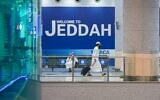 A handout picture provided by the Saudi Ministry of Media on July 25, 2020, shows masked traveler walking at the Red Sea coastal city of Jeddah's King Abdulaziz International Airport.  (Saudi Ministry of Media / AFP)
