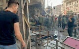 This image released by Syrian television on Telegram shows people gathering at the site of an explosion in the town of Sayeda Zeinab on the outskirts of Damascus on July 27, 2023. (Syrian TV/AFP)