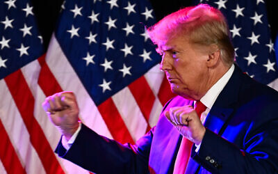 Former US president and 2024 Republican Presidential hopeful Donald Trump dances after speaking at a Republican volunteer recruitment event at Fervent, a Calvary Chapel, in Las Vegas, Nevada, July 8, 2023. (Photo by Patrick T. Fallon / AFP)