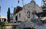 Rescuers work outside a destroyed church after a Russian missile strike in Zaporizhzhia, on August 10, 2023. (Marina Moiseyenko / AFP)
