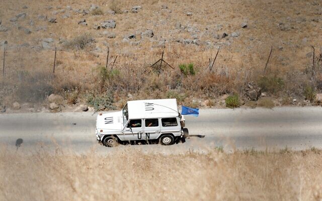 This picture taken from the village of Ghajar shows a vehicle of the United Nations Interim Forces in Lebanon (UNIFIL) passing along the border fence separating Lebanon and Israel, on August 9, 2023. (Jalaa Marey/AFP) This picture taken from the village of Ghajar shows a vehicle of the United Nations Interim Forces in Lebanon (UNIFIL) passing along the border fence separating Lebanon and Israel, on August 9, 2023. (Jalaa Marey/AFP)