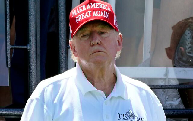 Former US president Donald Trump looks on during Round 3 at the LIV Golf-Bedminster 2023 at the Trump National in Bedminster, New Jersey, on August 13, 2023. (Timothy A. Clary/AFP) Former US president Donald Trump looks on during Round 3 at the LIV Golf-Bedminster 2023 at the Trump National in Bedminster, New Jersey, on August 13, 2023. (Timothy A. Clary/AFP)