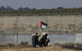 Masked Palestinians in the Gaza Strip riot along the border with Israel on August 21, 2023. (Mohammed Abed/AFP)