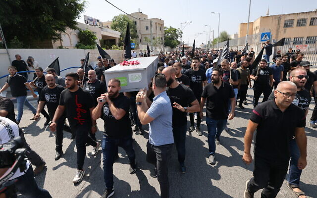 Arab Israeli mourners attend the funeral of Abdel Rahman Kashua, the director-general of the Arab city of Tira who was gunned down this week, during his funeral on August 23, 2023 (AHMAD GHARABLI / AFP) Arab Israeli mourners attend the funeral of Abdel Rahman Kashua, the director-general of the Arab city of Tira who was gunned down this week, during his funeral on August 23, 2023 (AHMAD GHARABLI / AFP)