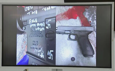 This video grab shows a press conference screen displaying a handgun found on the scene of a shooting in Jacksonville, Florida, August 26, 2023. (AFP)