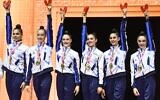 Gold medalists of Team Israel stand on the podium during the medal ceremony of the group all-around event of the Olympic qualifier 40th FIG Rhythmic Gymnastics World Championships in Valencia on August 25, 2023. (JOSE JORDAN / AFP)