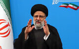 Iran's President Ebrahim Raisi greets media representatives after a press conference in Tehran on August 29, 2023. (AFP)