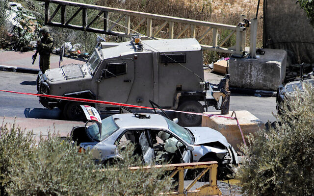 The scene of a suspected attempted car-ramming attack near the West Bank city of Hebron, August 30, 2023. (MOSAB SHAWER / AFP) The scene of a suspected attempted car-ramming attack near the West Bank city of Hebron, August 30, 2023. (MOSAB SHAWER / AFP)