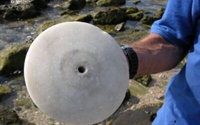 A rare 2,500-year-old marble disc found off Israel's coast in July 2023. (Israel Antiquities Authority)