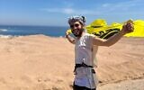 Nehorai Tamsit waves a Chabad flag, July 2023. (Facebook; used in accordance with Clause 27a of the Copyright Law)