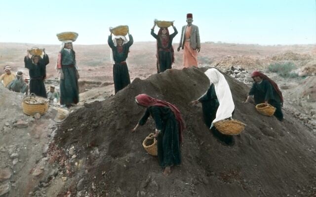 Women carrying baskets of excavated earth to the dump pile at Tell en-Naṣbeh in 1935 while others pick pottery sherds out of the dirt mound. (Courtesy of the Badè Museum/Pacific School of Religion)