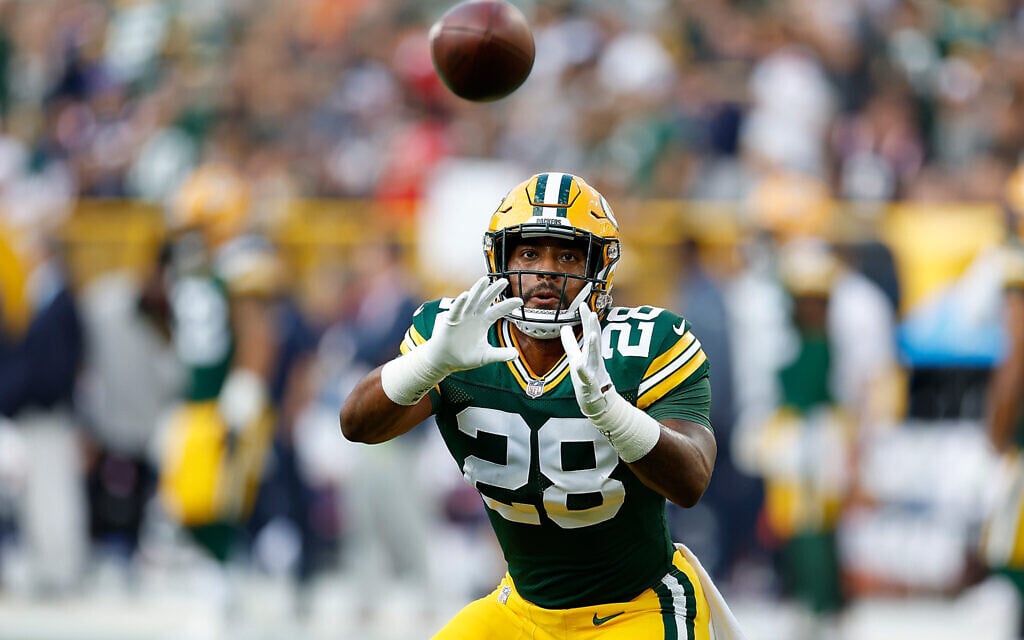 AJ Dillon of the Green Bay Packers warms up before the preseason game 
against the New England Patriots at Lambeau Field on August 19, 2023, in Green Bay, Wisconsin. (Photo by John Fisher/Getty Images via JTA)