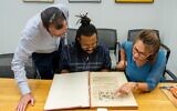 Christian students enrolled in the master's program for Jewish studies at Yeshiva University read a piece of text from the book of Shemot, or Exodus, while on a tour of the campus guided by Jewish educators. (Courtesy Yeshiva University via JTA)