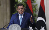 Libyan Prime Minister Abdul Hamid Dbeibeh delivers his statement at the end of a meeting with Italian Prime Minister Mario Draghi at Chigi palace, Premier's office, in Rome, Monday, May 31, 2021.  (Gregorio Borgia, Pool/AP)