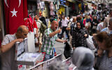 Illustrative: Sellers attend to customers in a street market in Eminonu commercial district in Istanbul, Turkey, on June 16, 2023. (AP Photo/Francisco Seco, File)