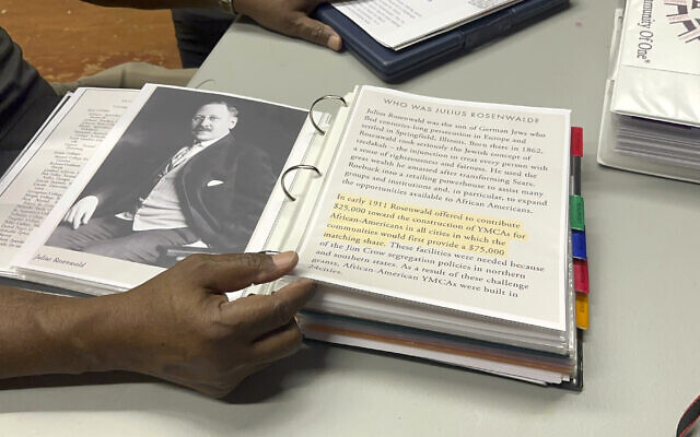Pastor Charlie Grant shows a binder of information he has about Rosenwald Schools and Julius Rosenwald, gathered as he worked to restore a building in Hampton County on Tuesday, July 11, 2023, in Hampton, South Carolina. (AP Photo/Jeffrey Collins) Pastor Charlie Grant shows a binder of information he has about Rosenwald Schools and Julius Rosenwald, gathered as he worked to restore a building in Hampton County on Tuesday, July 11, 2023, in Hampton, South Carolina. (AP Photo/Jeffrey Collins)