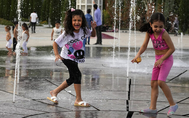 Children enjoy a water fountain at the Ebrahim Park while the temperature reaches 38°C (100.4°F) in Tehran, Iran, August 1, 2023. (AP Photo/Vahid Salemi) Children enjoy a water fountain at the Ebrahim Park while the temperature reaches 38°C (100.4°F) in Tehran, Iran, August 1, 2023. (AP Photo/Vahid Salemi)