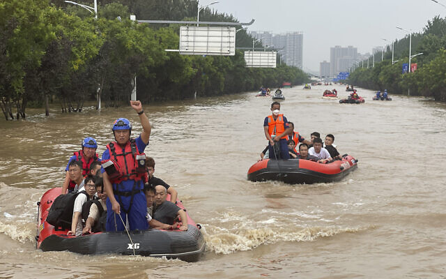 Residents are evacuated by rubber boats through flood waters in Zhuozhou in northern China's Hebei province, south of Beijing, Wednesday, Aug. 2, 2023. (AP Photo/Andy Wong) Residents are evacuated by rubber boats through flood waters in Zhuozhou in northern China's Hebei province, south of Beijing, Wednesday, Aug. 2, 2023. (AP Photo/Andy Wong)