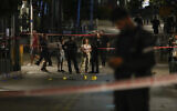 Israeli police inspect the site of a deadly terrorist shooting attack in Tel Aviv, August 5, 2023. (AP Photo/Maya Alleruzzo)