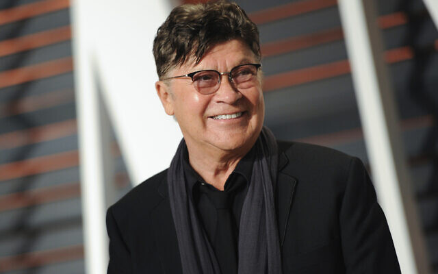 FILE - Musician Robbie Robertson arrives at the Vanity Fair Oscar Party on Sunday, Feb. 22, 2015, in Beverly Hills, Calif. (Photo by Evan Agostini/Invision/AP, File) FILE - Musician Robbie Robertson arrives at the Vanity Fair Oscar Party on Sunday, Feb. 22, 2015, in Beverly Hills, Calif. (Photo by Evan Agostini/Invision/AP, File)