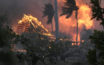 The hall of historic Waiola Church in Lahaina and nearby Lahaina Hongwanji Mission are engulfed in flames along Wainee Street in Lahaina, Hawaii, on August 8, 2023. (Matthew Thayer/The Maui News via AP)