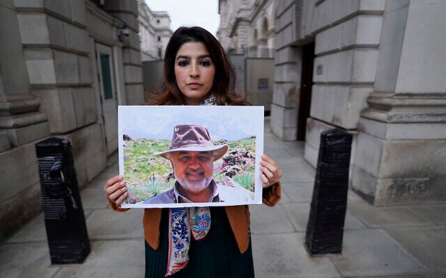 Roxanne Tahbaz holds a picture of her father, Morad Tahbaz, who is jailed in Iran, during a protest outside the UK Foreign, Commonwealth and Development Office in London, April 13, 2022. (Stefan Rousseau/PA via AP, File) Roxanne Tahbaz holds a picture of her father, Morad Tahbaz, who is jailed in Iran, during a protest outside the UK Foreign, Commonwealth and Development Office in London, April 13, 2022. (Stefan Rousseau/PA via AP, File)
