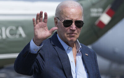 US President Joe Biden waves as he walks to board Air Force One at Dover Air Force Base, Delaware, June 19, 2023. (Susan Walsh/AP)