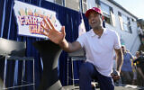 Republican presidential candidate Vivek Ramaswamy waves after taking part in a Fair-Side Chat with Iowa Gov. Kim Reynolds at the Iowa State Fair Saturday, Aug. 12, 2023, in Des Moines, Iowa. (AP/Jeff Roberson)