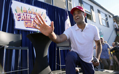 Republican presidential candidate Vivek Ramaswamy waves after taking part in a Fair-Side Chat with Iowa Gov. Kim Reynolds at the Iowa State Fair Saturday, Aug. 12, 2023, in Des Moines, Iowa. (AP/Jeff Roberson)