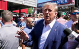 Republican presidential candidate and former US president Donald Trump speaks as he visits the Iowa State Fair, Saturday, August 12, 2023, in Des Moines, Iowa. (AP Photo/Charlie Neibergall)
