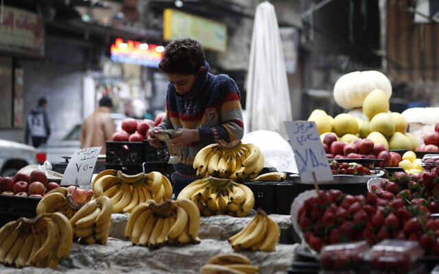Shopkeeper waits for customers in Damascus, Syria, on Dec. 15, 2022 (AP Photo/Omar Sanadiki, File)
