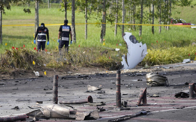 Members of the fire and rescue department inspect the crash site of a small plane in Shah Alam district, Malaysia, Aug. 17, 2023. (AP Photo/Vincent Thian) Members of the fire and rescue department inspect the crash site of a small plane in Shah Alam district, Malaysia, Aug. 17, 2023. (AP Photo/Vincent Thian)