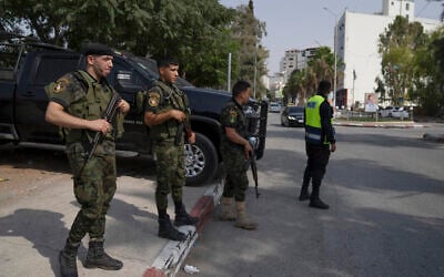 Palestinian security forces stationed at a main junction in the West Bank city of Jenin, Sunday, Aug. 13, 2023. (AP/Nasser Nasser)