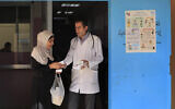 File: A Palestinian woman receives medicine from a doctor at a clinic run by the agency for Palestinian refugees, or UNRWA, in the Ein el-Hilweh refugee camp in the southern port city of Sidon, Lebanon, June 20, 2023. (AP Photo/Mohammed Zaatari)